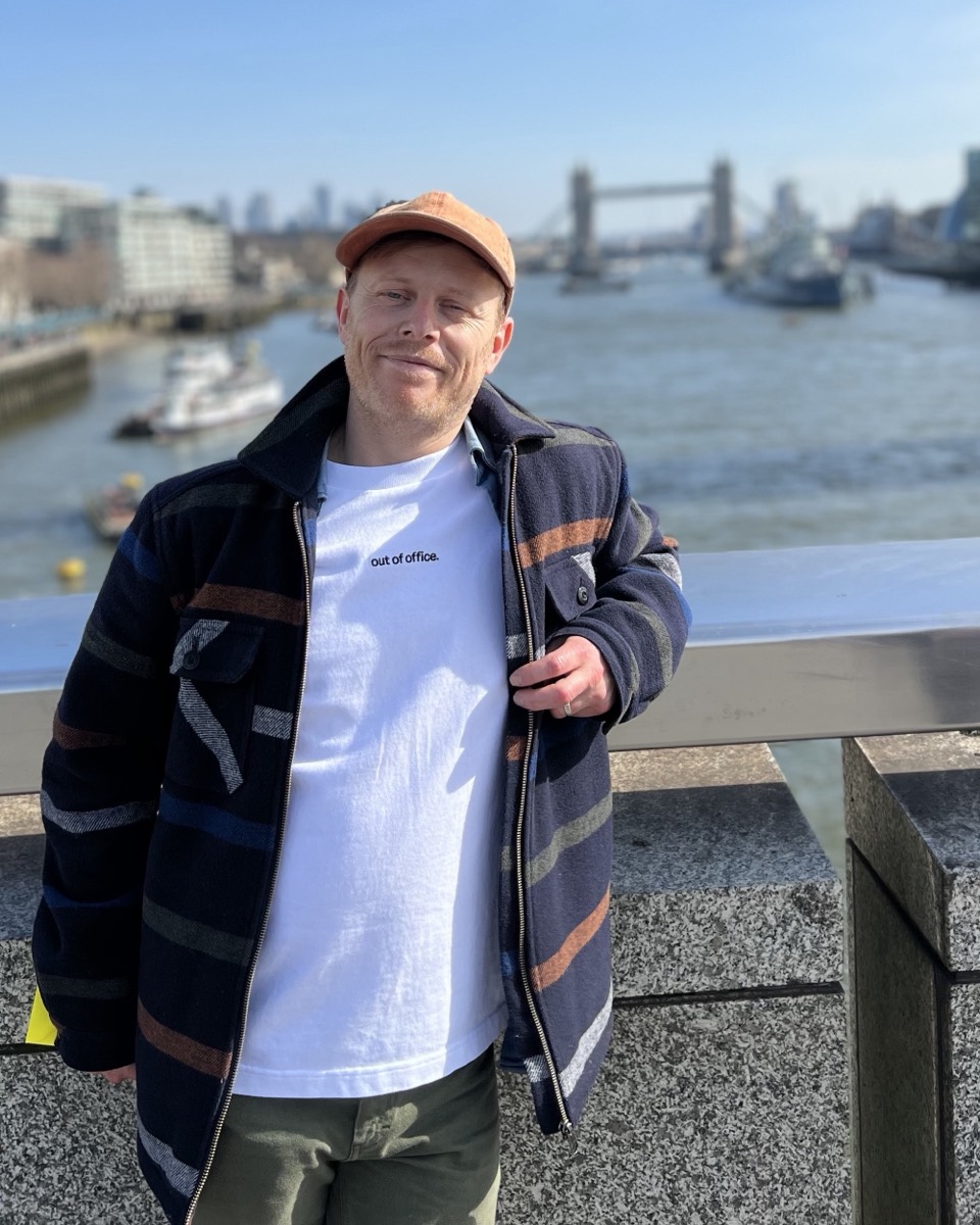 Mark Dunbavan, founder of Noori, on London Bridge with Tower Bridge behind him.